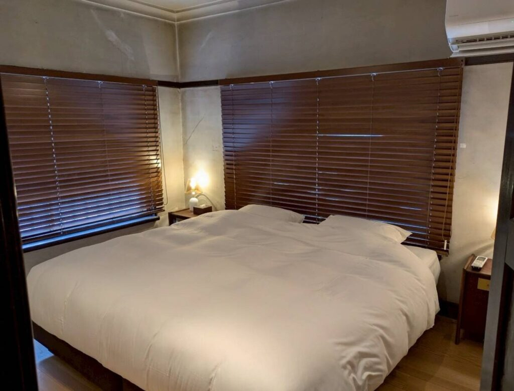 another bedroom with a king-size bed.